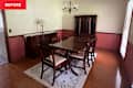 Rectangular dining table in dining room before renovation.