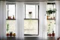 sheer window treatments span three windows