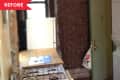 Narrow kitchen with brick wall, gas stove, wooden countertop, and stacked washer-dryer.