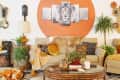 Living room with lion artwork and tan, orange, and green color scheme