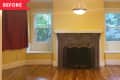 Living room with yellow walls, brick fireplace, hardwood floors, and two windows with red curtains.