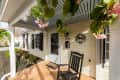 Brick porch with black rocking chair