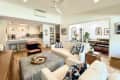 The living room with white couch and chair