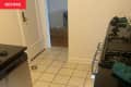 White stone tiled floors in apartment before renovation.