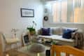 Cream sofa in living area of apartment.