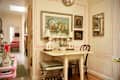 Matching dog lamps on folding dining table in eclectic apartment.