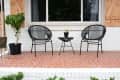 Acapulco chairs in outdoor sitting area.