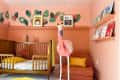 A large stuffed flamingo in the a renovated nursery.