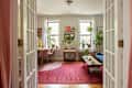 French doors opened up to living/dining area in light filled Brooklyn apartment.