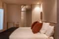 minimal beige bedroom with decorative door