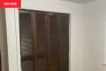 Before: Brown bi-fold closet doors