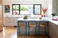 Blue stools under kitchen countertop.