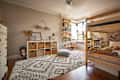 Bunk beds in bedroom with cube storage, books on shelves, and layered area rugs.
