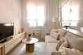 Beige sofa in newly renovated living room.