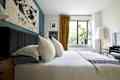White bedroom with white bed