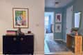 blue entry way with art, mirror, console table