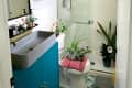 Plant filled bathroom.