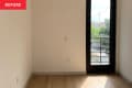 Corner of studio apartment before renovation.