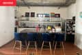 Basic loft kitchen with black, gray, and white tile backsplash