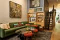 Green sectional in apartment living room
