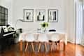 White dining room with piano