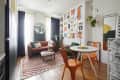 View of white dining, living areas from kitchen area.
