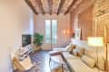 Brick lined walls in ceiling in newly renovated apartment.