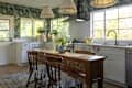 Blue floral wallpaper in sunny kitchen.