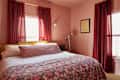 Pink bedroom with pink floral bed
