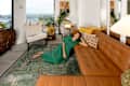 Dweller leading of leather sofa in living room.