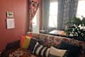 maximalist living room with lots of floral patterns