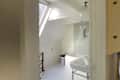 Large windows in white bathroom