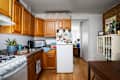 Wood cabinets in apartment kitchen.