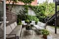 Outdoor lounge area in urban garden.