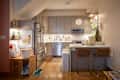 Grey cabinets in kitchen of Brooklyn apartment.