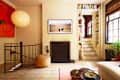 Books and fireplace in white living room