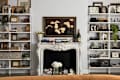 White fireplace mantel in vintage inspired living room.