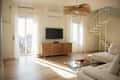 Bright living room with a white sectional sofa, glass coffee table, wooden sideboard, and spiral staircase.
