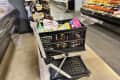 Clax shopping cart in grocery store.
