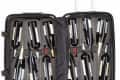 Open suitcase with foam inserts holding twelve wine bottles upright.