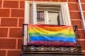 rainbow flag hanging from a balcony