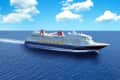 A large cruise ship sailing through deep blue ocean waters under a clear sky with fluffy clouds.