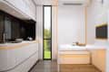 Interior of kitchen with lots of curved lines in tiny home