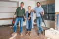 Lisa Kudrow and the Property Brothers holding tools