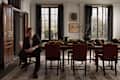 Jeremiah Brent sitting in dining room with one of his rugs for Loloi