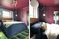Cozy bedroom with a dark purple wall, a wooden bed, leopard print pillows, and a green chain light fixture.