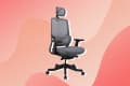 Ergonomic office chair with mesh back, adjustable armrests, and headrest on a pink abstract background.