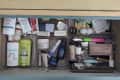 A make up drawer with plastic organizers