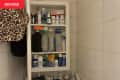 Bathroom medicine cabinet before being organized.