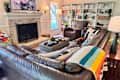 Couch with pillows and blankets.